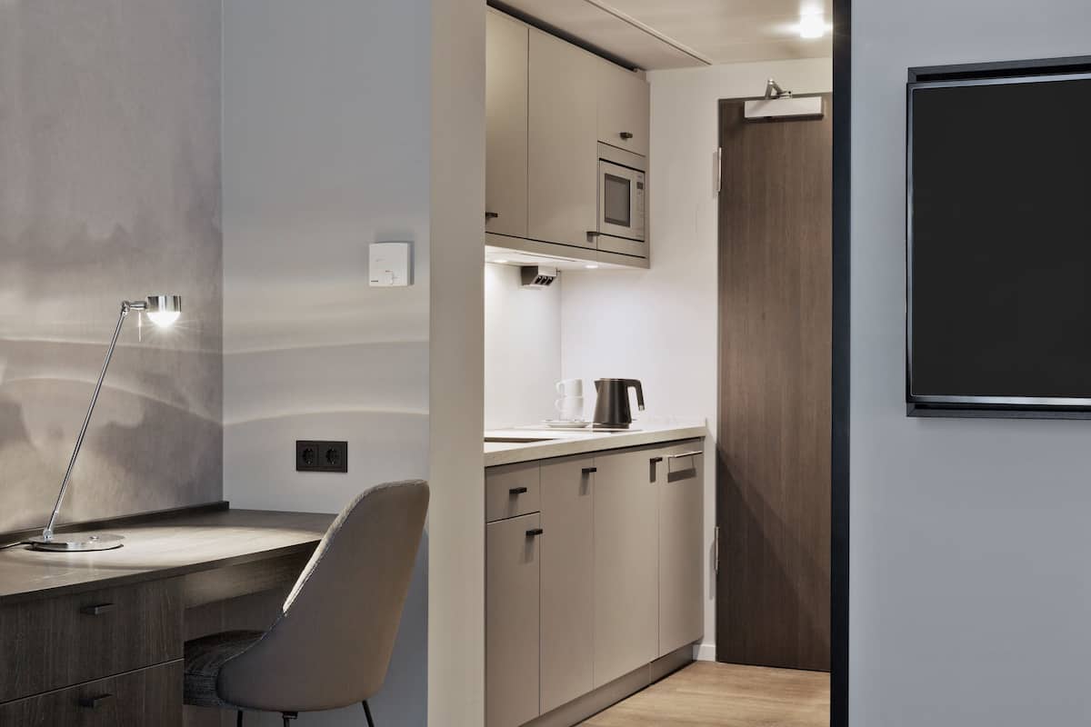 comfort studio, 1 king bed with sofa bed, courtyard view | hypo-allergenic bedding, in-room safe, iron/ironing board