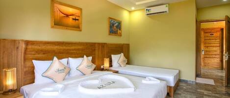 Deluxe Triple Room, Garden View | 1 bedroom, in-room safe, soundproofing, free WiFi