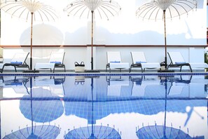Seasonal outdoor pool, open 8:30 AM to 7:30 PM, pool umbrellas