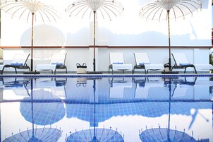 Seasonal outdoor pool, open 8:30 AM to 7:30 PM, pool umbrellas