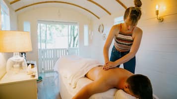 Relax and unwind in this serene space, where expert therapists offer soothing massages on a comfortable table.