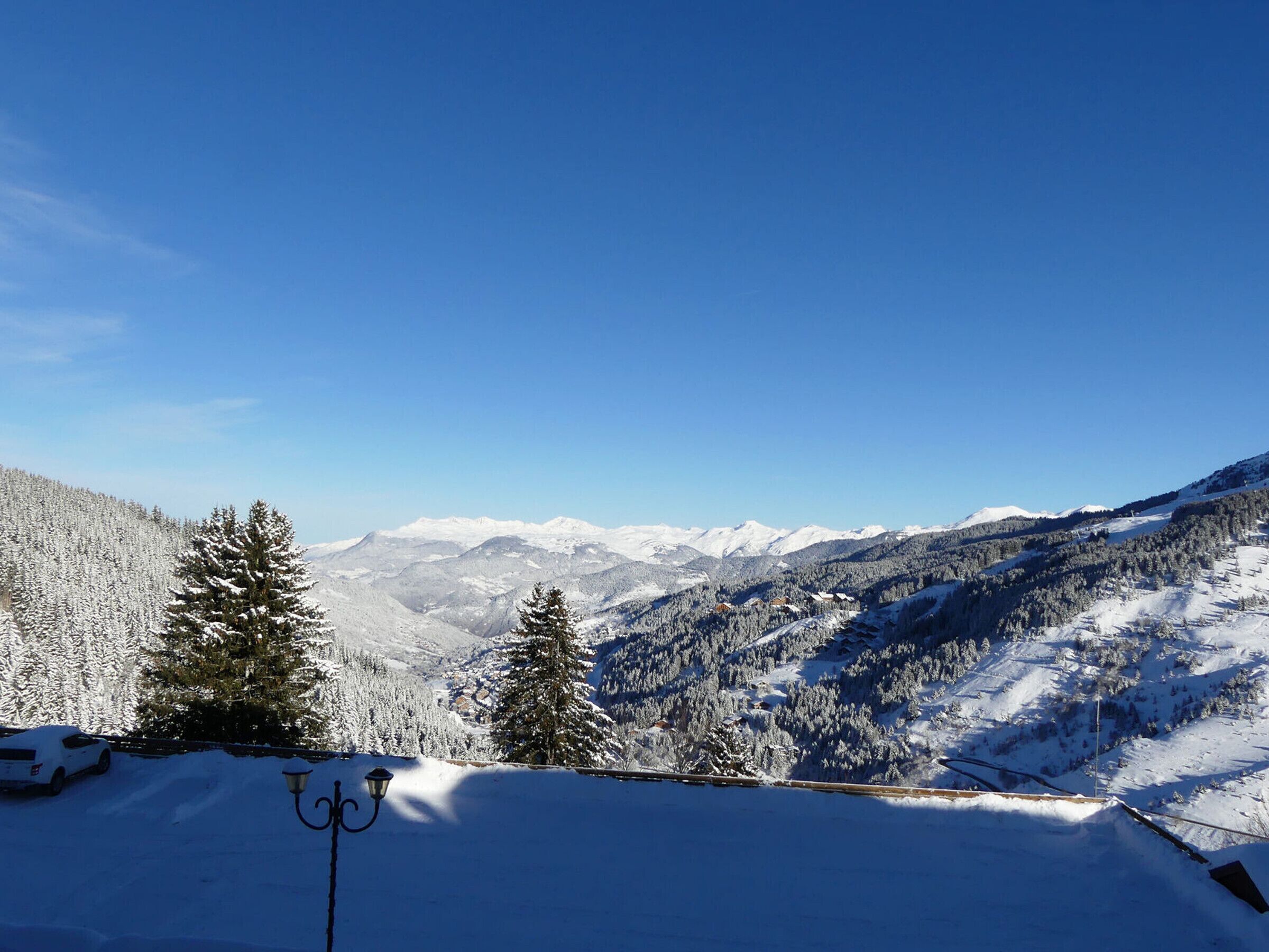 A snow-covered mountain landscape with a clear sky.
