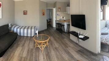 Family Apartment, 2 Bedrooms | Living area | Flat-screen TV, Netflix, streaming services