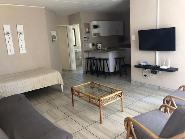 Family Apartment, 2 Bedrooms | Living room | Flat-screen TV, Netflix, streaming services