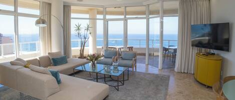 Luxury Apartment | Living area | Flat-screen TV