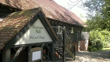 A traditional building with a sign reading "Bartons Mill Pub and Inn."