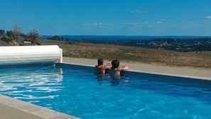Seasonal outdoor pool, open 9:00 AM to 7:00 PM, pool umbrellas