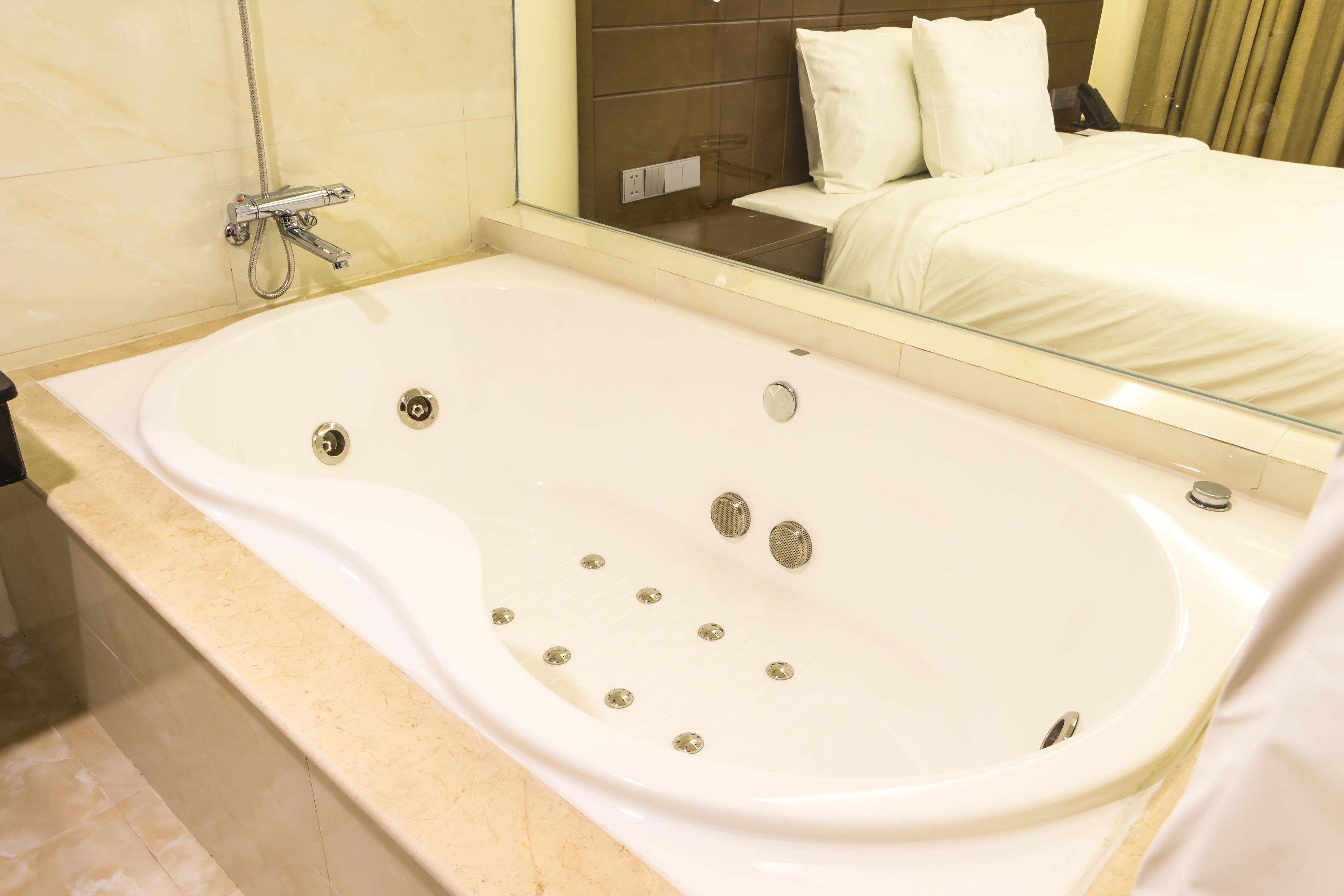 suite | bathroom | separate bathtub and shower, deep-soaking bathtub, rainfall showerhead