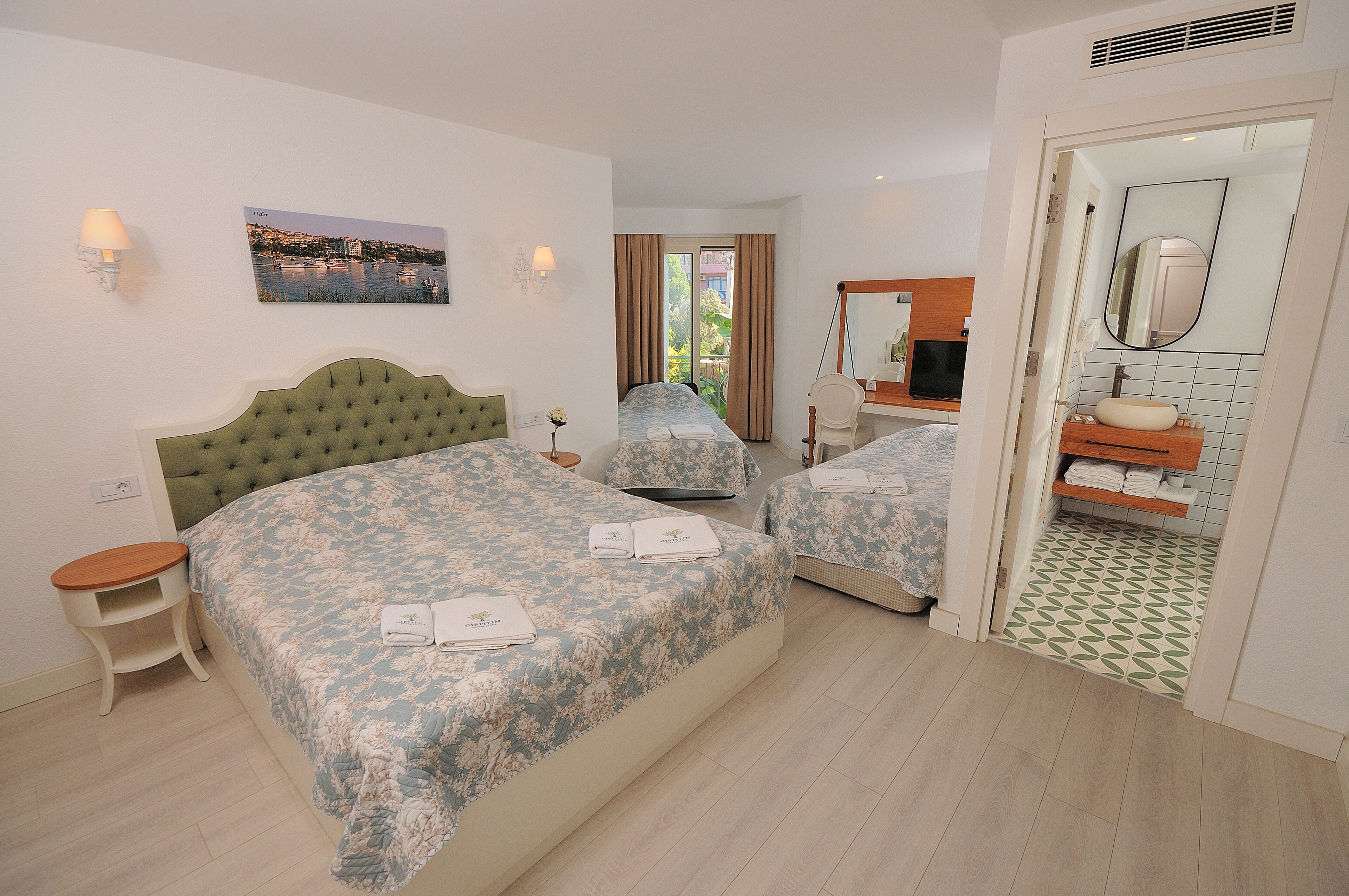 family room | free minibar items, in-room safe, desk, laptop workspace