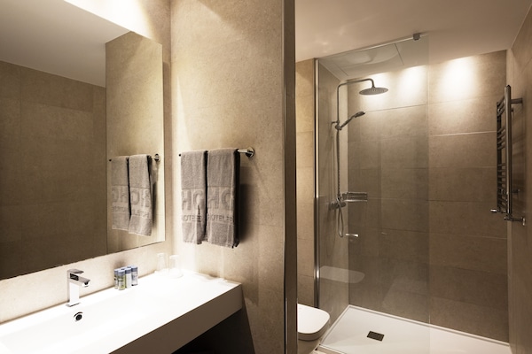 Standard Double Room | Minibar, in-room safe, desk, blackout drapes