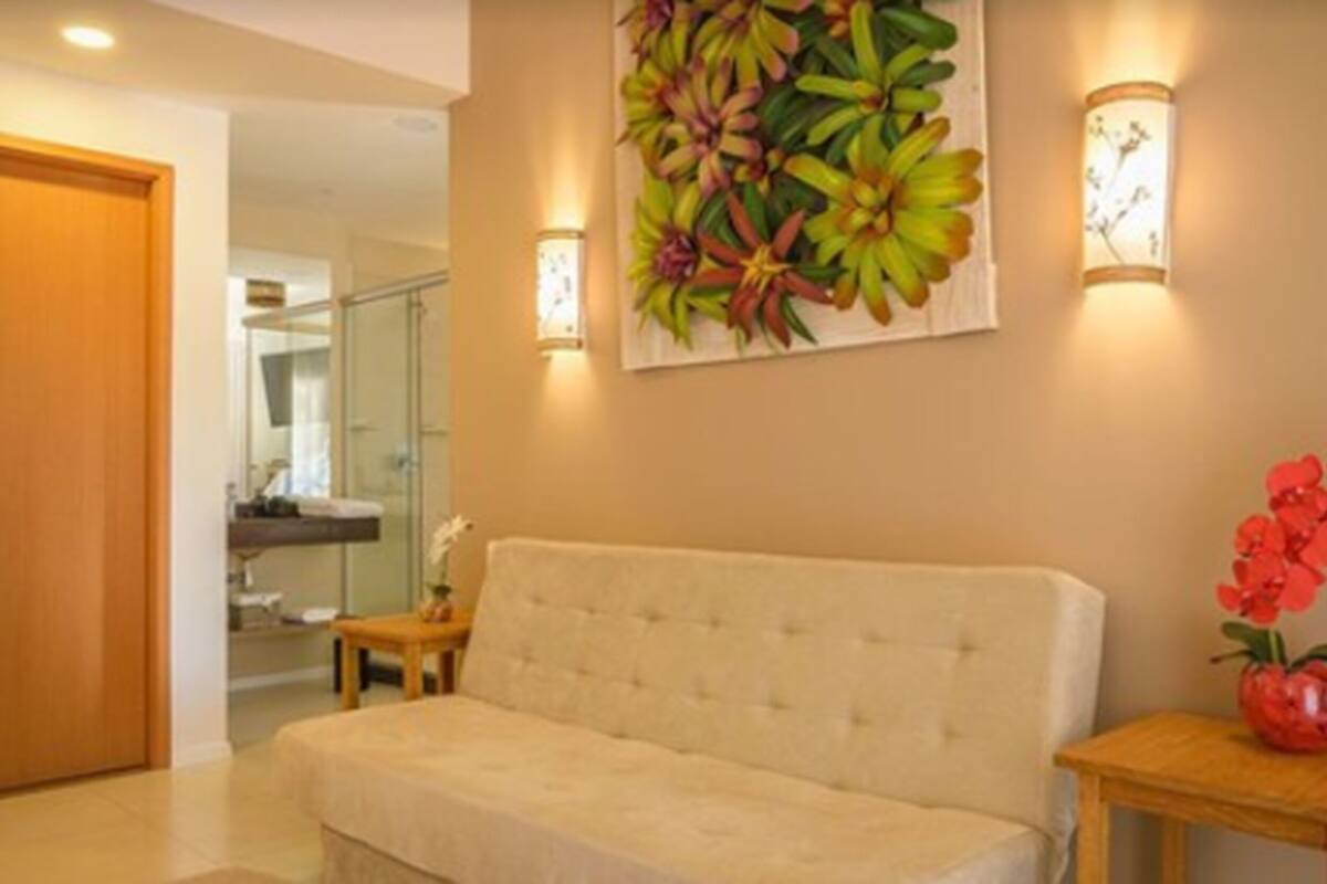 deluxe suite (master) | living area | lcd tv