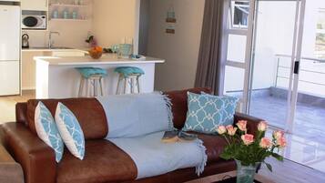 The View Self Catering Apartment | Living room | TV