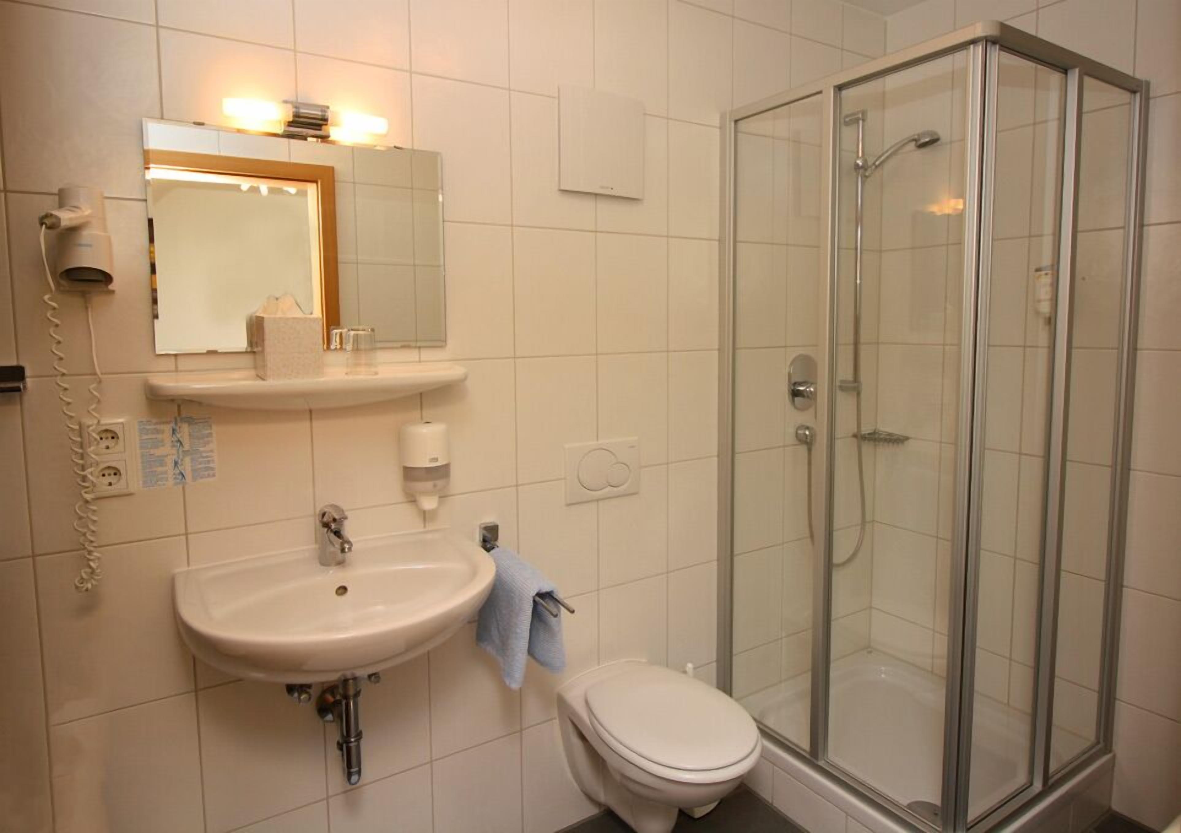 shower, free toiletries, hair dryer, towels