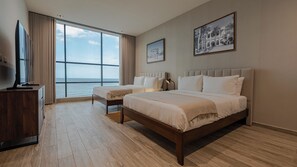 Habitación Deluxe, vistas al mar | Sábanas de algodón egipcio, colchones con acolchado adicional, minibar