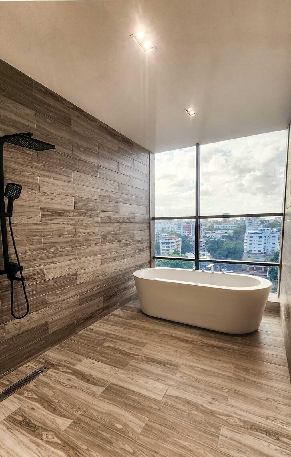 junior studio suite, city view | bathroom | shower, free toiletries, towels