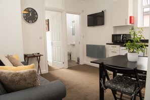 Apartment, 1 Bedroom | Living area | Flat-screen TV