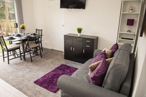 Apartment, 1 Bedroom | Living room | Flat-screen TV