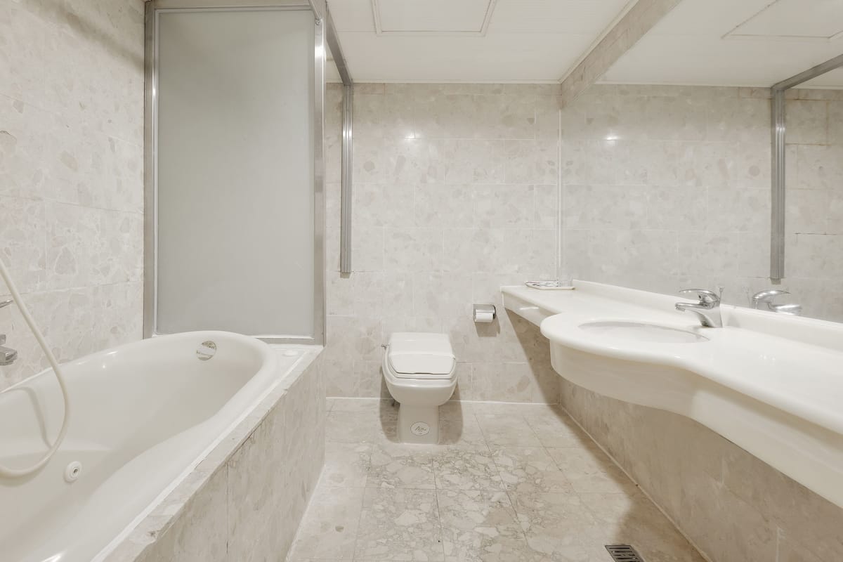 Standard Quadruple Room, 2 Double Beds | Bathroom | Free toiletries, hair dryer, slippers, towels