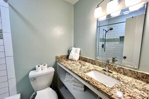 A bathroom with a toilet, sink, and shower. - Sunrise Ge 212 2 Bedroom Condo by RedAwning (Gulf Shores)