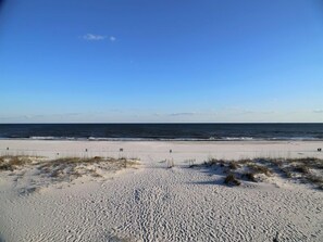A beach with a clear sky and calm sea. - H Oz-Toto 3 Bedroom Home by RedAwning (Gulf Shores)