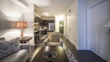 Deluxe Apartment, 1 Queen Bed, Accessible | Living area | Flat-screen TV