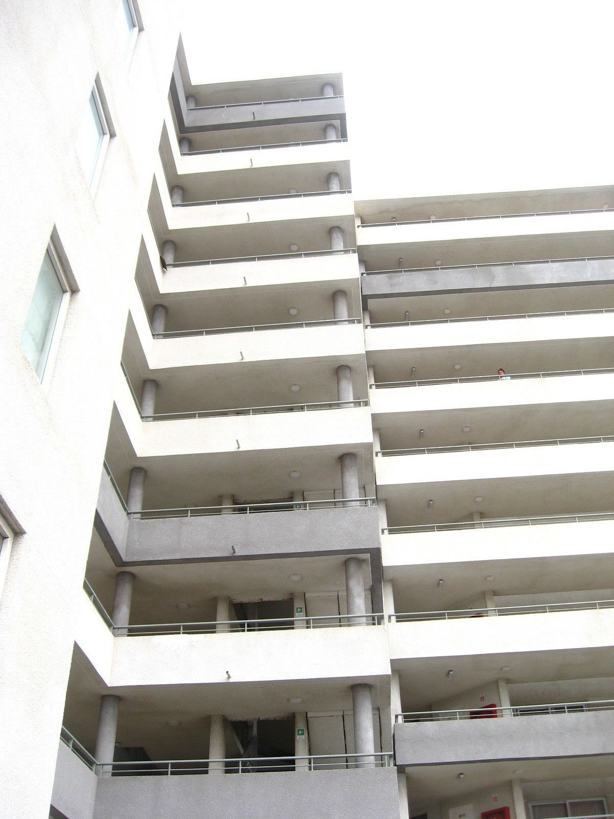 A multi-story building with balconies on each floor.