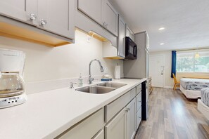 Fridge, microwave, stovetop, coffee/tea maker