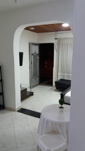Basic Apartment, Multiple Beds | Living area | 42-inch Smart TV with cable channels, TV