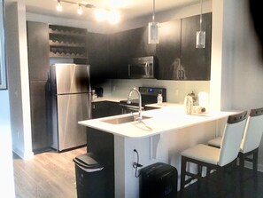 Deluxe Apartment, 1 Queen Bed, Accessible | Private kitchen | Fridge, microwave, oven, stovetop - Buckhead with views of Midtown Downtown (Atlanta)