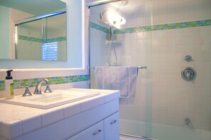 Combined shower/tub, hair dryer, towels, soap