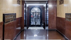 A polished lobby with a grand entrance, a metal elevator, and a wall-mounted mailbox. - Penthouse in Centro Historico with 2 Bedroom/2 Bathroom & Private Terrace (Centro)