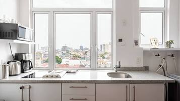 Fridge, microwave, stovetop, coffee/tea maker