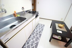 Appartement, non-fumeur | Cuisinette privée | Réfrigérateur, four à micro-ondes, surface de cuisson