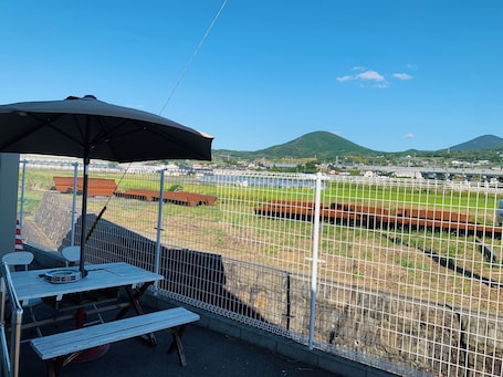 Economy Double Room | Living area | Flat-screen TV