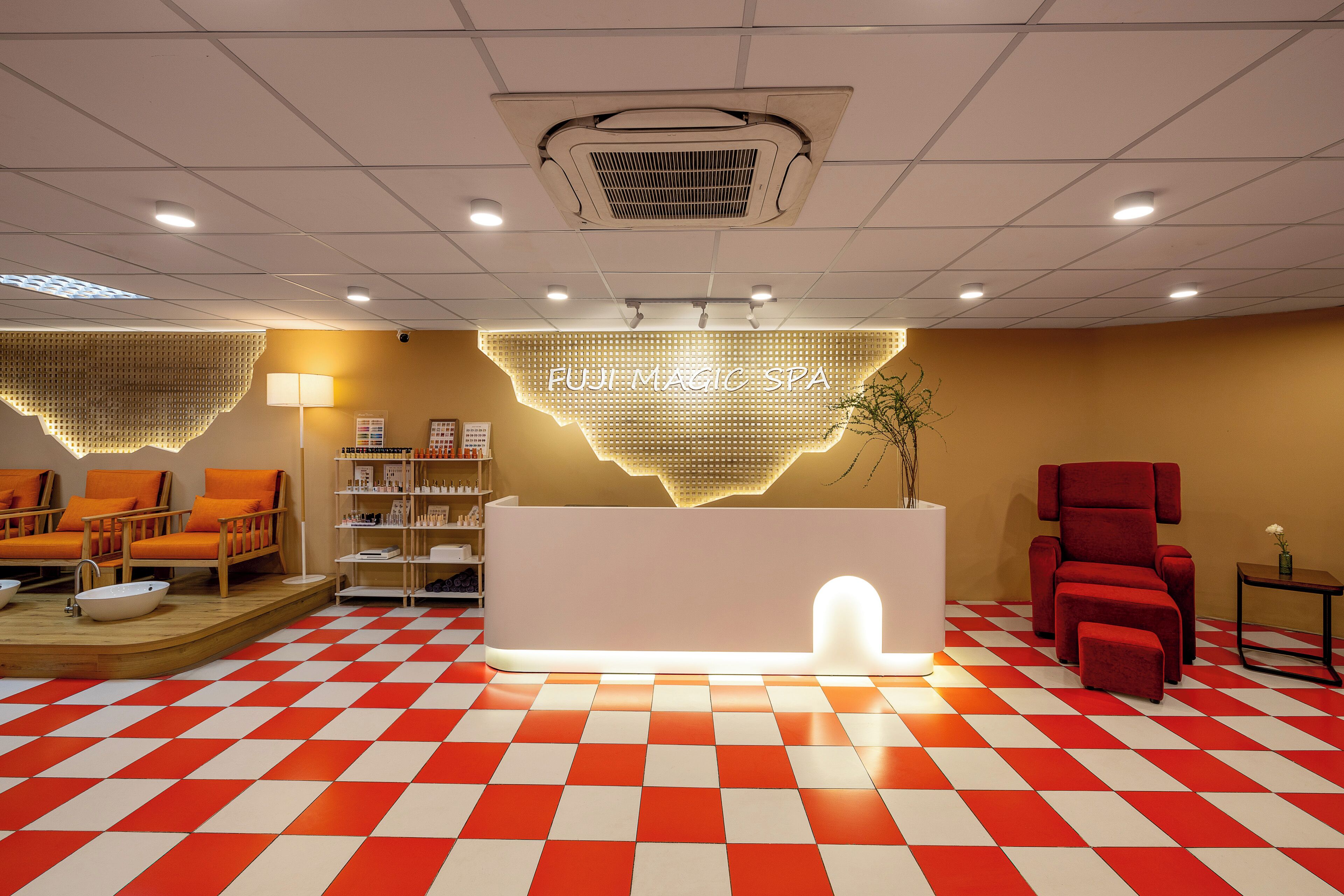 A reception area with a checkered floor, a reception desk, and seating areas.