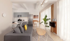 Deluxe Suite (P1 / P2) | Living area | Smart TV, books, stereo - The Marble Suites, PLAKA (Athens)