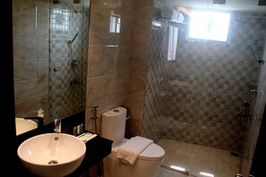A bathroom with a sink, toilet, and shower. - Hotel X (Pirozali)