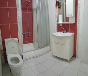 Apartment, 2 Bedrooms | Bathroom | Deep-soaking bathtub, free toiletries, hair dryer, slippers