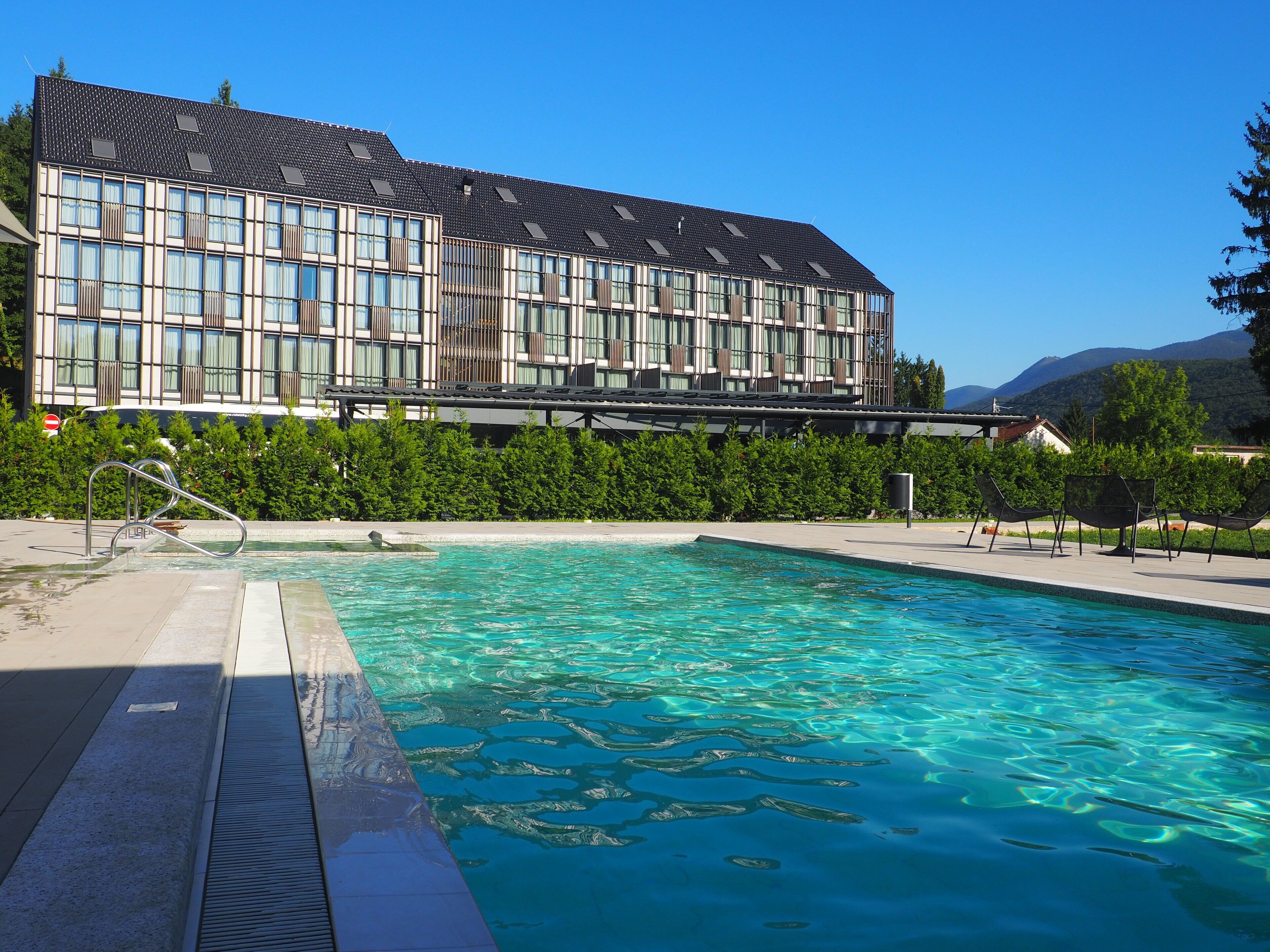 seasonal outdoor pool, open 8:00 am to 8:00 pm, pool umbrellas