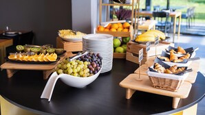 A breakfast buffet with various fruits, pastries, and a coffee station. - Lyra Hotel Plitvice (Plitvicka Jezera)