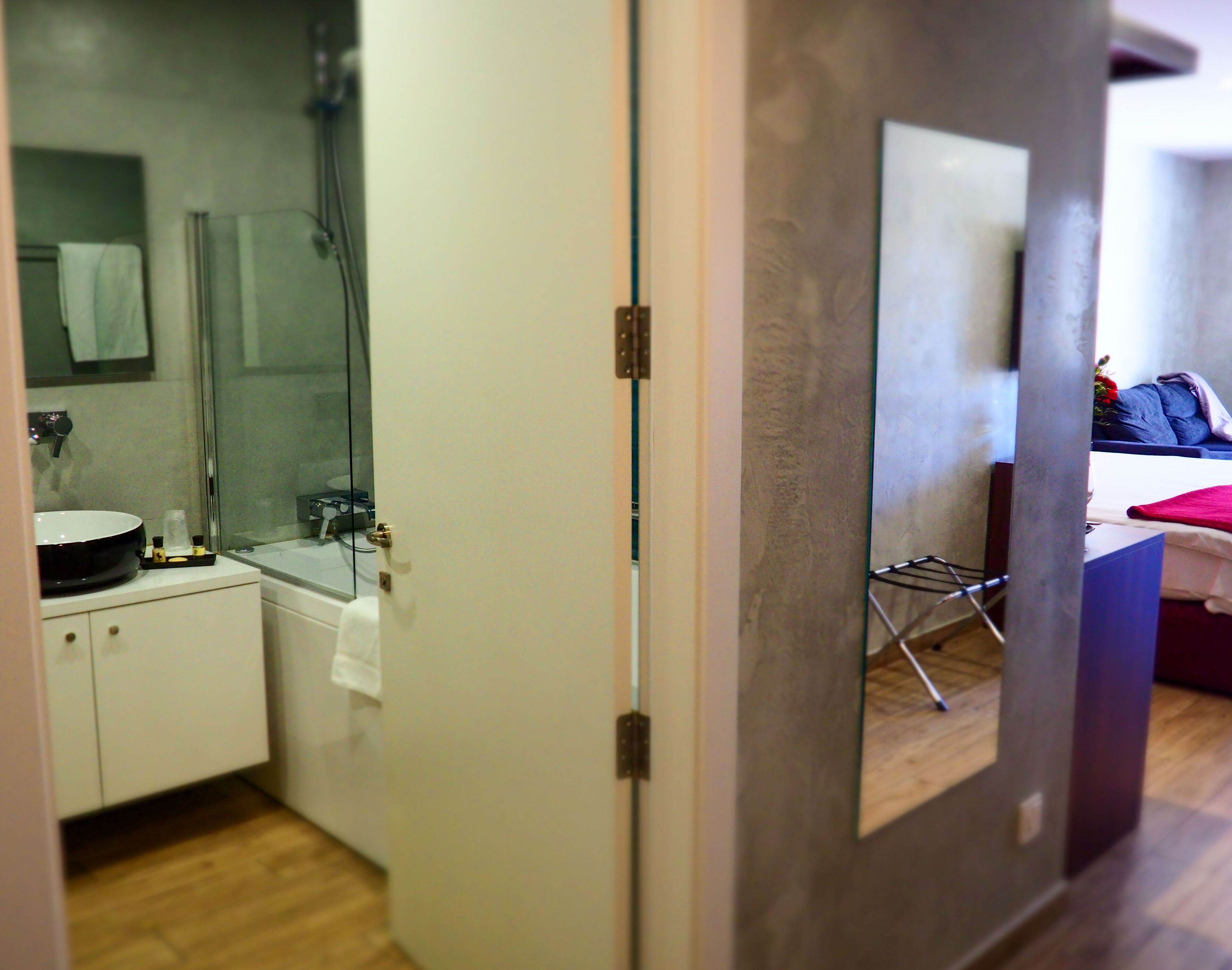 deluxe double or twin room | bathroom | deep-soaking bathtub, rainfall showerhead, free toiletries, hair dryer