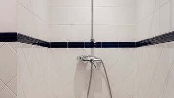 Apartment, 3 Bedrooms | Bathroom | Shower, free toiletries, hair dryer, slippers