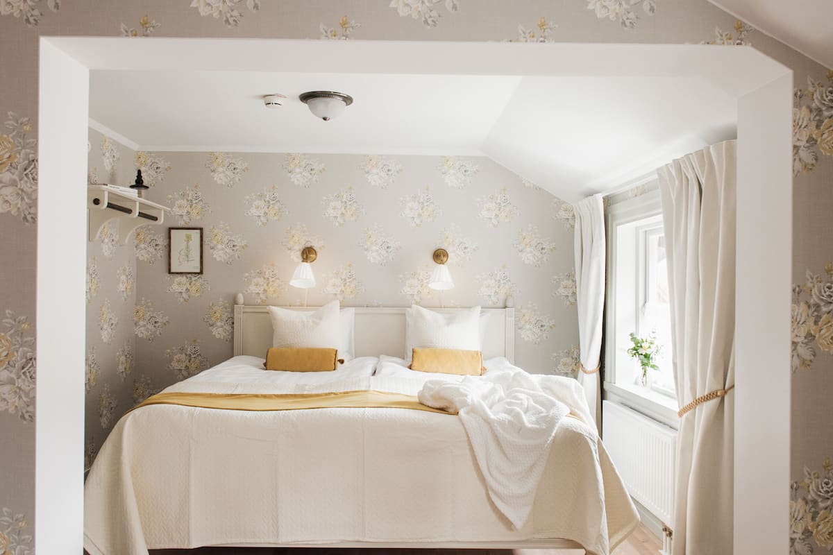 Double Room, Private Bathroom (Eva) | Blackout drapes, soundproofing, iron/ironing board, rollaway beds