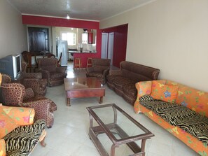 Family Apartment, 3 Bedrooms, Smoking, Sea View | Living room | Flat-screen TV - Apartamento Alejandro Magno (Borg el Arab)