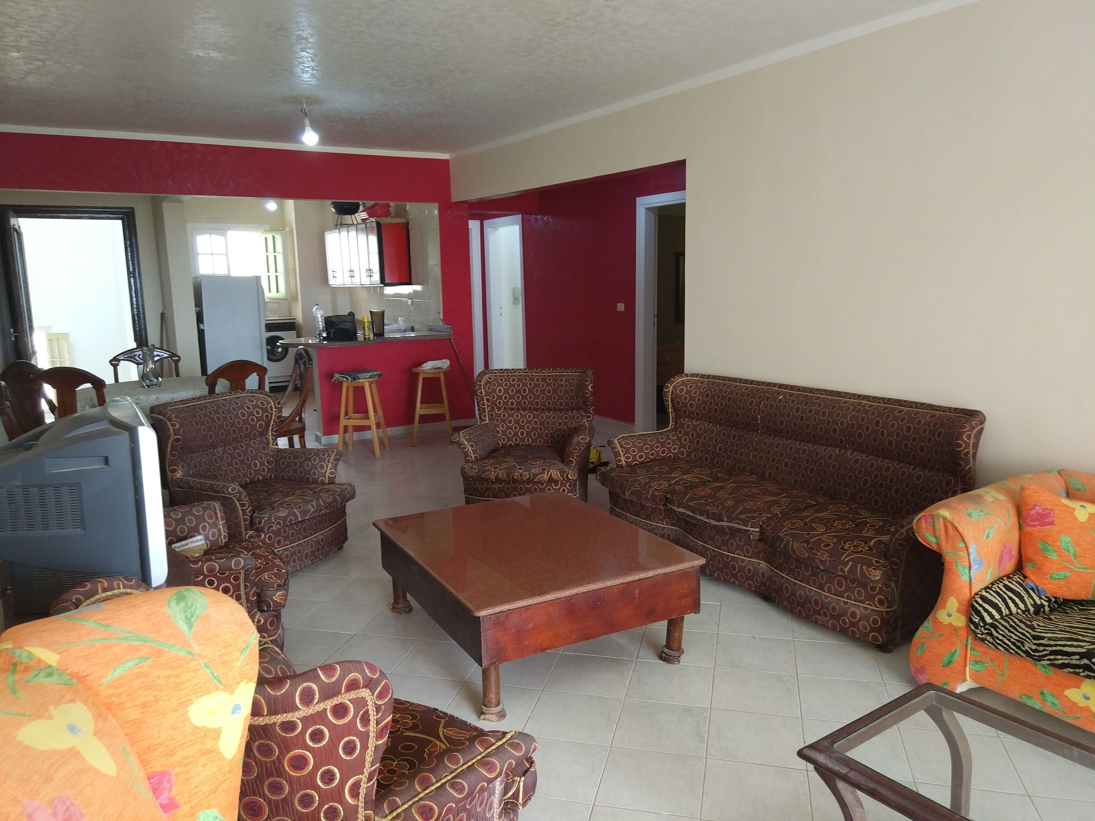 Family Apartment, 3 Bedrooms, Smoking, Sea View | Living room | Flat-screen TV