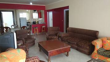 Family Apartment, 3 Bedrooms, Smoking, Sea View | Living room | Flat-screen TV
