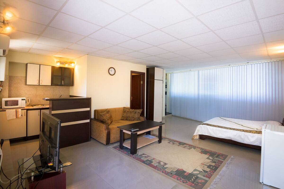 Superior Apartment | Living room | Flat-screen TV, fireplace