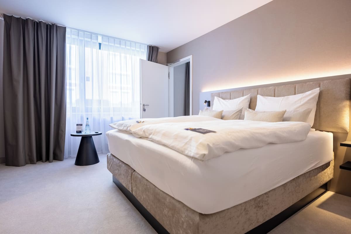 family room | 1 bedroom, in-room safe, desk, laptop workspace