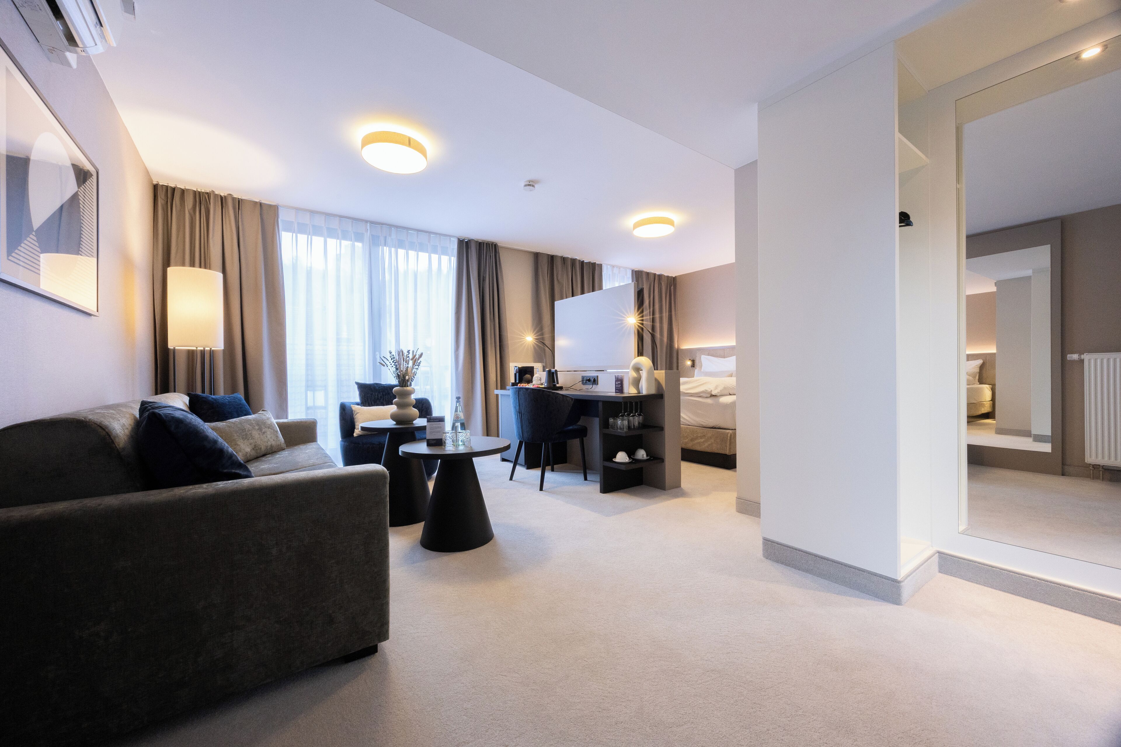 junior suite | 1 bedroom, in-room safe, desk, laptop workspace