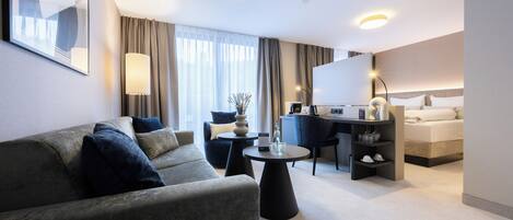 Junior Suite | 1 bedroom, in-room safe, desk, laptop workspace